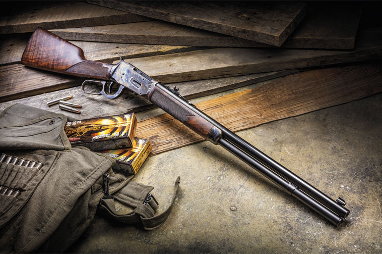 Winchester Model 94 Deluxe Sporting rifle with walnut stock and blued barrel