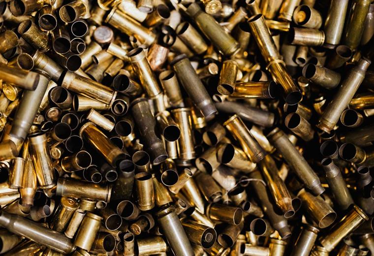A large pile of spent brass cartridge cases ready for reloading