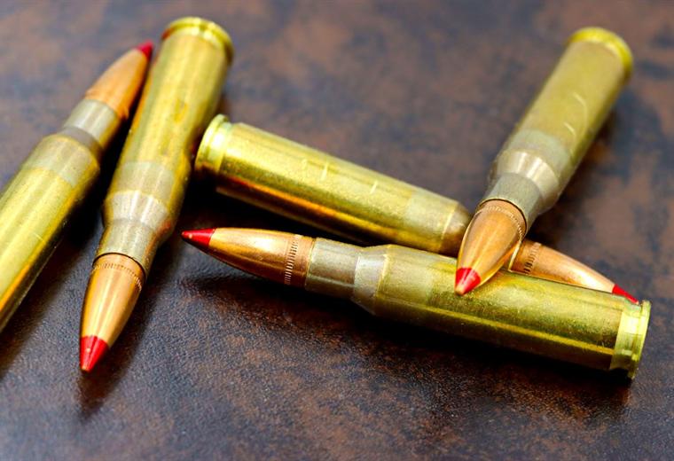 Large calibre rifle rounds with red polymer tips